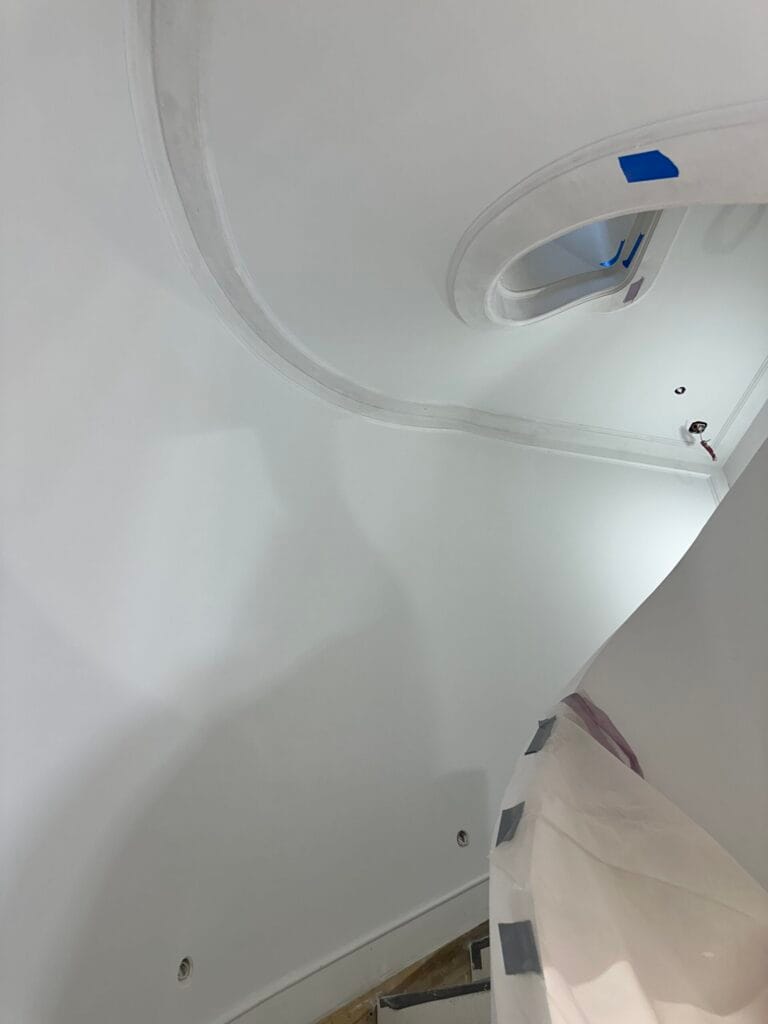Drywall installation and finishing around a staircase