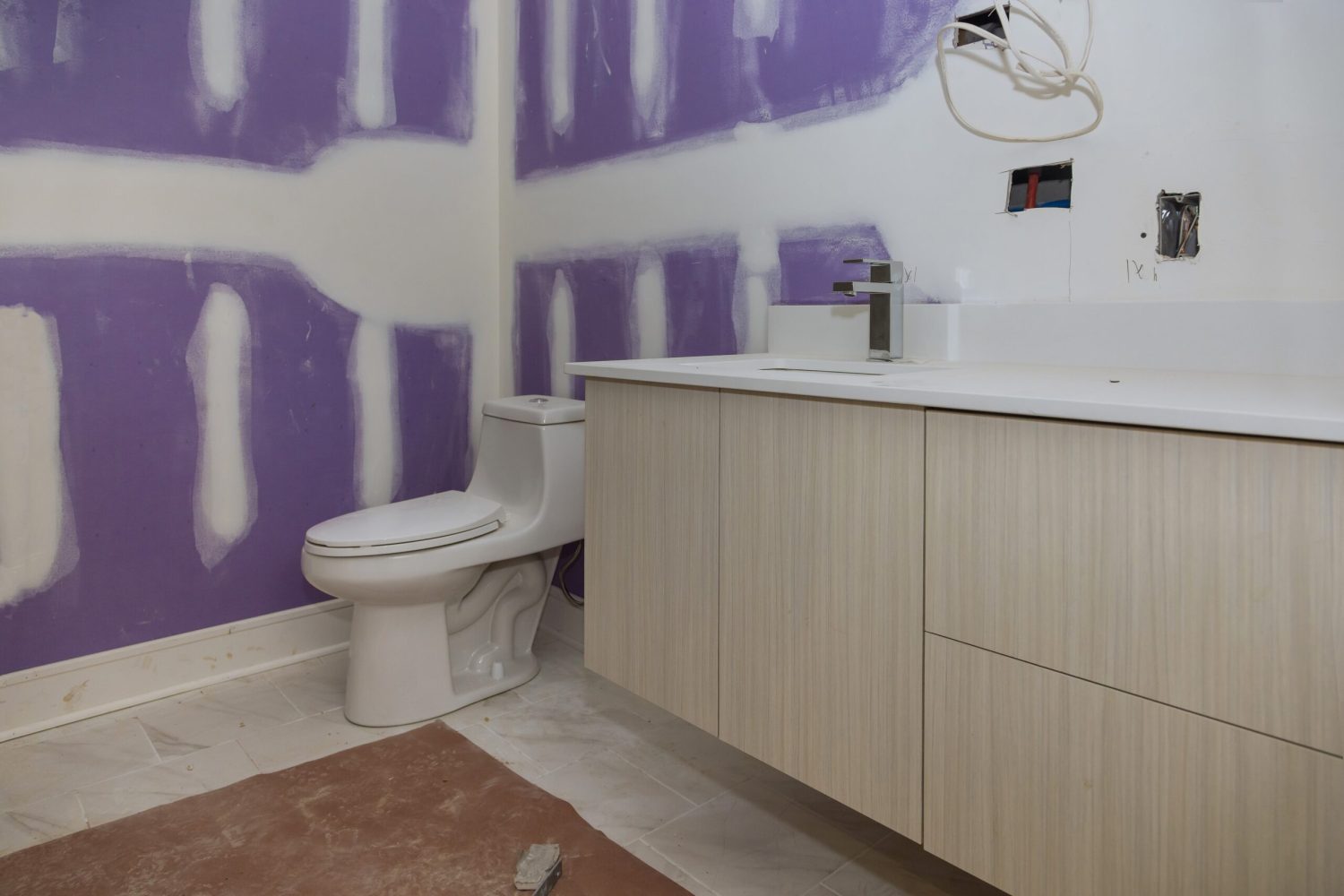 Master Bathroom with new under construction bathroom interior drywall ready for tile in new luxury home